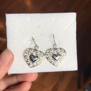 A pair of silver heart earrings